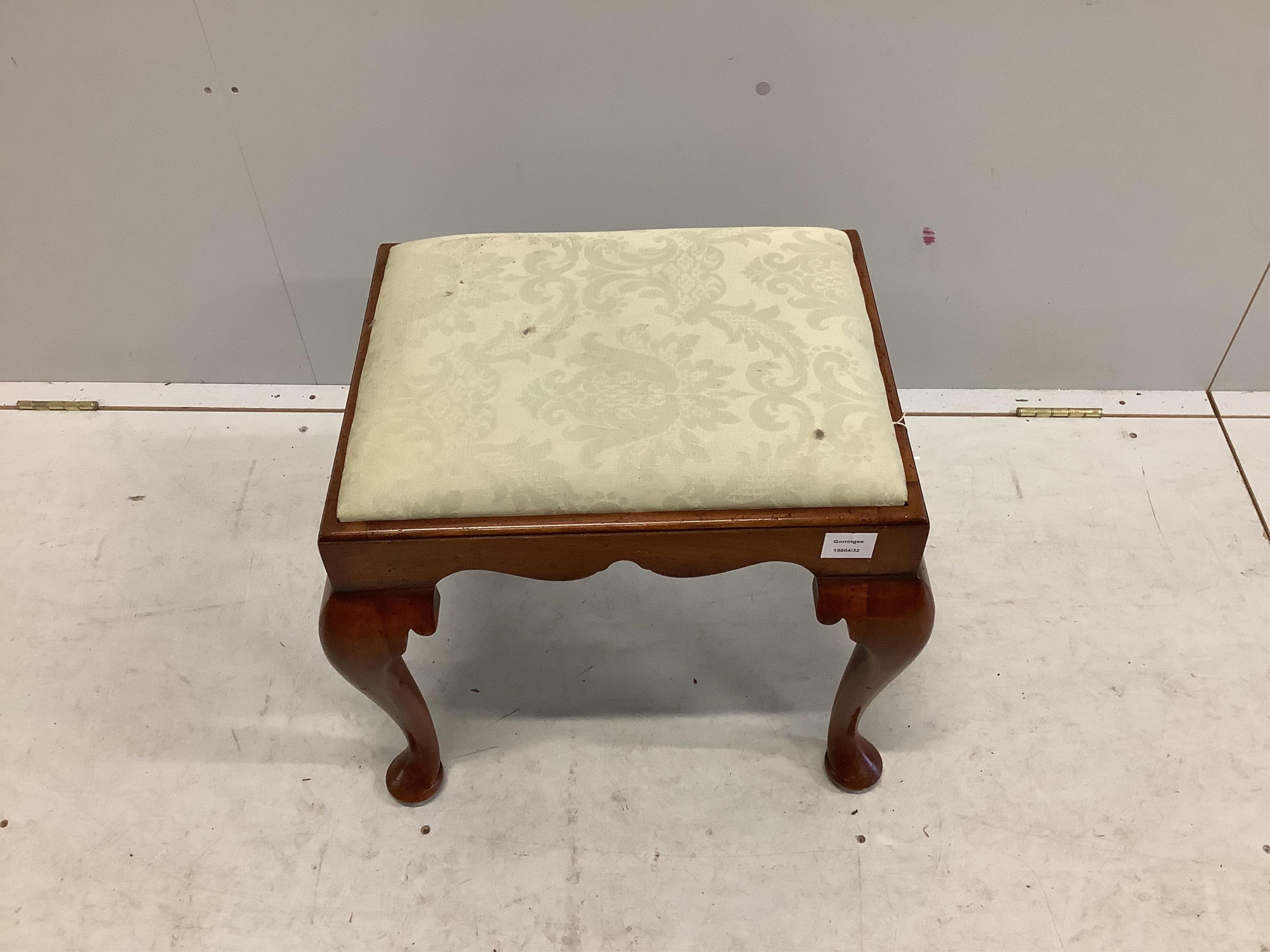 A Queen Anne style walnut dressing stool, with shaped frieze and cabriole legs, the drop in seat covered in silver fern cotton damask (Sandersons TCS, 1984), width 51cm, depth 41cm, height 45cm. Condition - fair to good